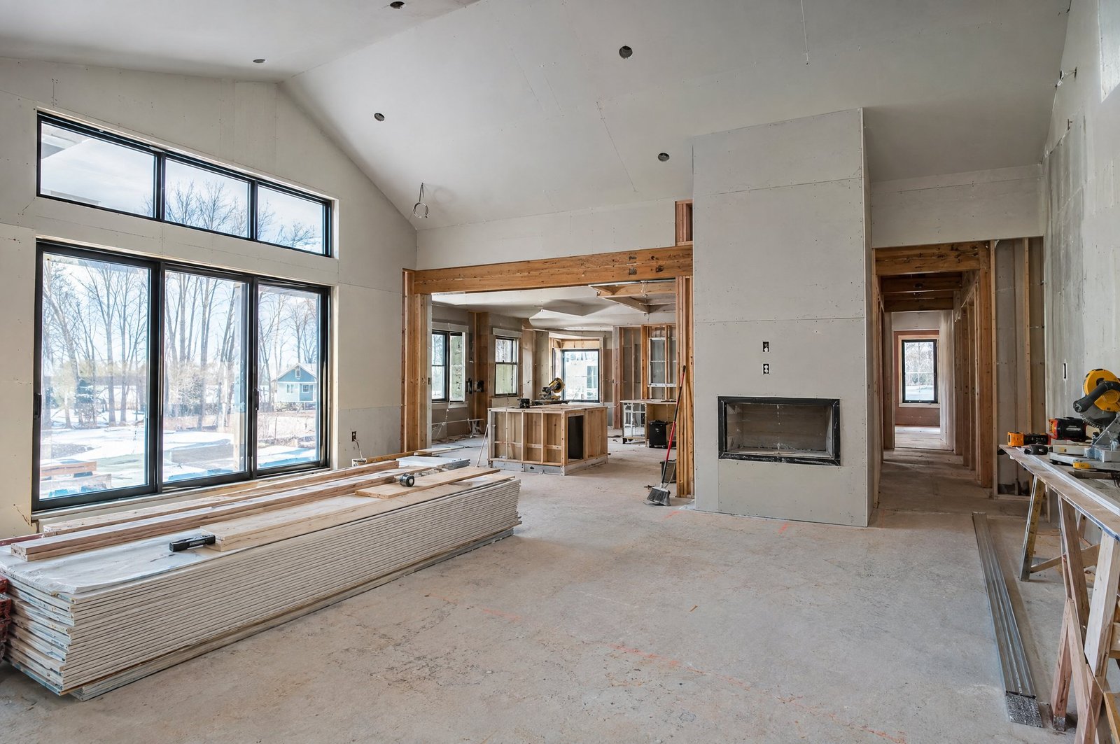Residential renovation in progress with new framing and drywall
